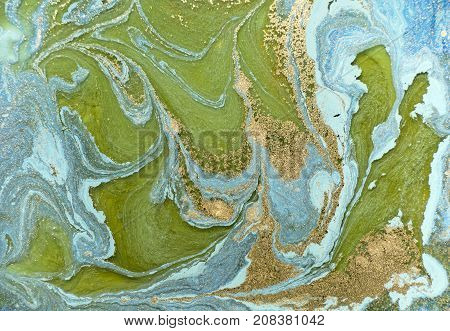 Marbled blue abstract background with golden sequins. Liquid marble ink pattern