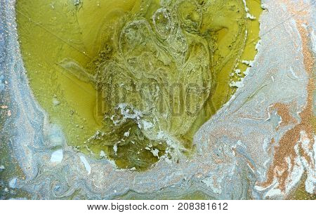 Marbled blue abstract background with golden sequins. Liquid marble ink pattern
