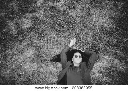 Portrait Of Stylish Modern Young Curly Woman In Coat Sunglasses