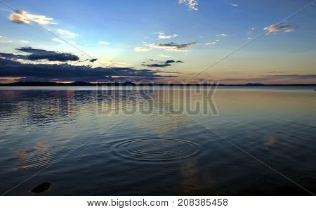 evening colorful cloudy sky over the lake, South Ural, Uvildy