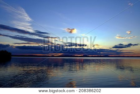 evening colorful cloudy sky over the lake, South Ural, Uvildy