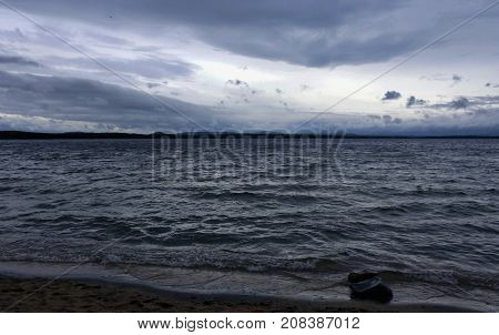 gray cloudy sky over the lake, South Ural, Uvildy