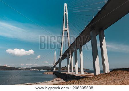 The long handsome cable-stayed bridge on the island is Russian. Beautiful background
