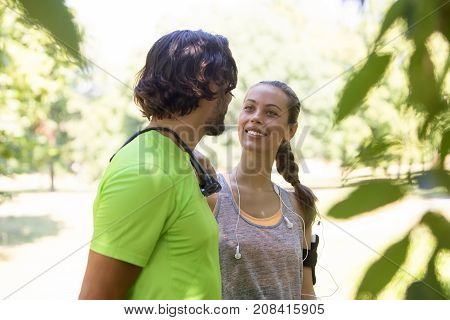 Smiling Couple Stretching Outdoors