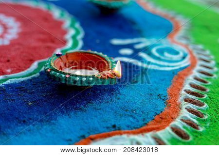 indian festival Diwali , rangoli around Diwali Lamp