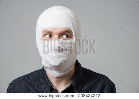 Man With Bandage On His Head