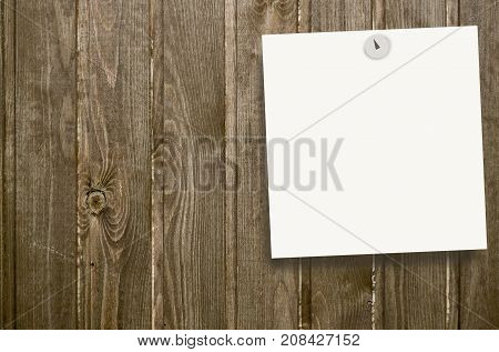 Place for writing (sticky note) pinned to a wooden wall