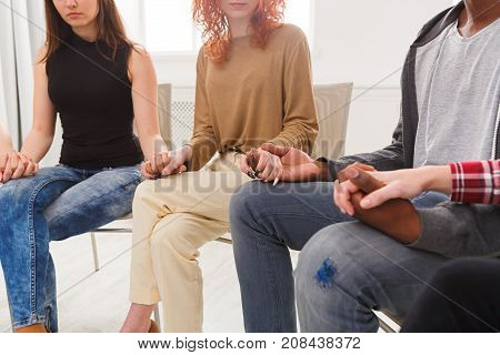 Trust circle. Company of people sitting together with united hands. Meeting of support group