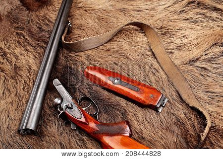 Old Double-barreled Shotgun, Disassembled, Gun On Wild Boar Furs.top View. Copy Space