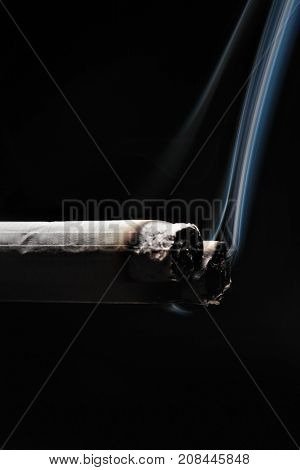 Two Smoking Cigarette On Black Background.copy Space