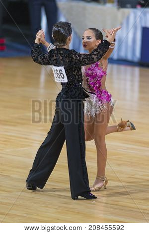 Minsk Belarus-October 7 2017: Dance Couple Of Samadashvili Avtandil and Gogishvili Elene Performs Youth-2 Latin-American Program on WDSF International Capital Cup MinskOctober 72017 MinskBelarus.