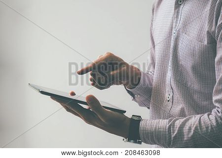 Business process photo. Account manager using mobile phone. Typing contemporary smartphone screen.