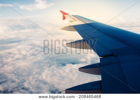 Sky and cloud above from airplane window.