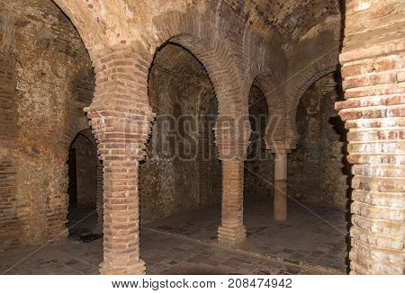 RONDA,SPAIN - SEPTEMBER 29,2017 - Columns in hammam (Banos Arabes) of Ronda. Ronda is a city in the Spanish province of Malaga.