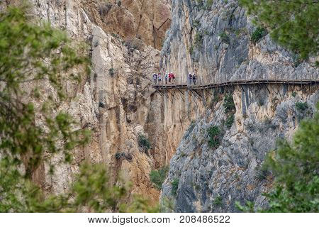 Long shot of King's Little Path footpath across vertical wall with tourists, one of the most Dangerous in the world n2