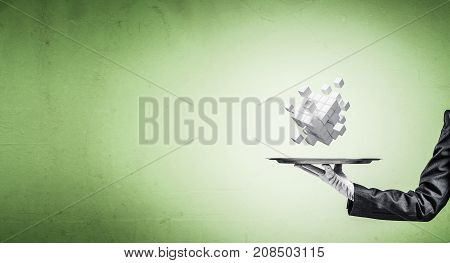 Cropped image of waiter's hand in white glove presenting multiple cubes on metal tray with green background. 3D rendering.