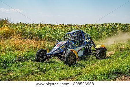 Ruse district, Bulgaria - July 21, 2017. Ivanovo village area, Ruse region, Bulgaria, Blue buggy in action