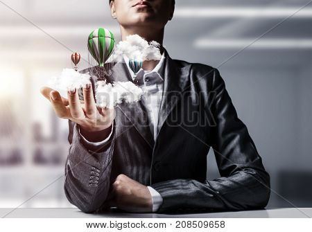 Closeup of business woman in suit presenting flying aerostate among clouds in her palm with office view on background. 3D rendering.