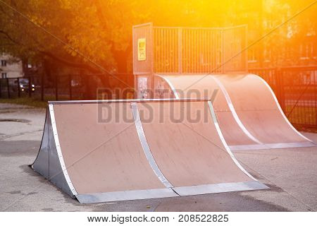 skate drop springboard in the park, a glare of light.