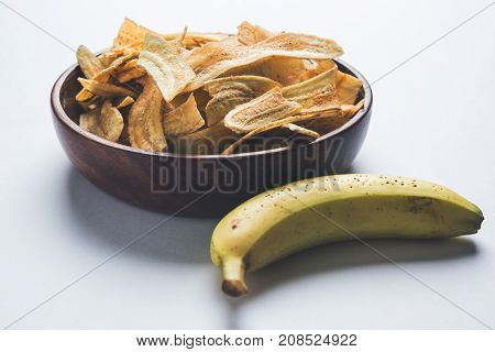 Stock Photo of Healthy Homemade Kela or Banana chips or wafers or Plantain Chips, selective focus