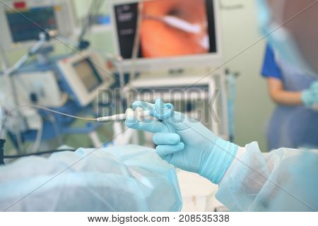 Female doctor performs endoscopy procedure in the hospital.