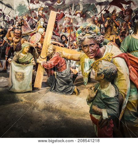 Via Crucis of Jesus Christ in a Passion of Christ biblical scene a woman show his child a Jesus Christ bringing his cross before his Crucifixion ( Varallo Italy May 24 2017)
