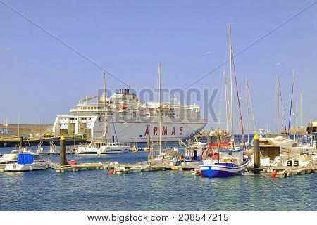 MORRO JABLE FUERTEVENTURA, SPAIN - OCTOBER 11 2017: View on the port of Morro Jable - Puerto de Morro Jable with a ship and boats.