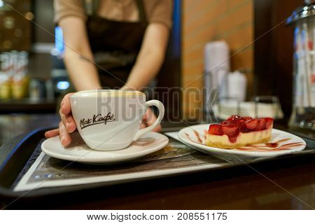 SAINT PETERSBURG, RUSSIA - CIRCA OCTOBER, 2017: close up shot of a cup with coffee at a McCafe. McCafe is a coffee-house-style food and beverage chain, owned by McDonald's.