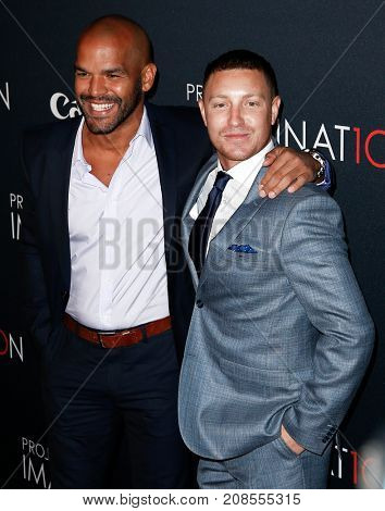 NEW YORK- OCT 24: Actors Amaury Nolasco and Lane Garrison (R) attend the premiere of Canon's 'Project Imaginat10n' Film Festival at Alice Tully Hall on October 24, 2013 in New York City.