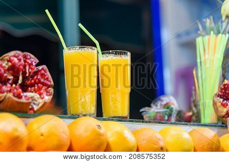 Fresh orange juice for sale in stall in Jemma El Fna square at nigh. Marrakech Morocco