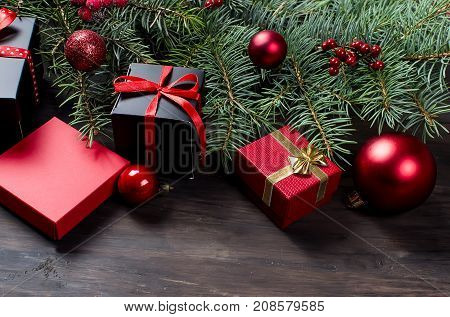 Black And Red  Christmas  Gift  Box With Red Ribbon And Fir Branches