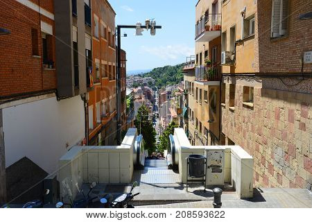 BARCELONA - JUN. 10, 2013: Baixada de la Glòria is a mountain road to Park Güell in  the Gràcia district of Barcelona, Catalonia, Spain.