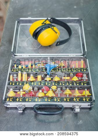A set of different yellow tips for drilling or hooking holes in a box