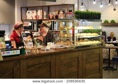 Chernihiv - 24 August 2017 / Ukraine: two waiters speak to each other in a café where they make delicious croissants. 24 August 2017 in Chernihiv, Ukraine.