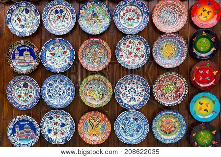 NESEBAR BULGARIA - AUGUST 21 2017: Background of plates with traditional national patterns. Showcase of a private shop selling souvenirs and gifts.