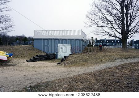 BAY VIEW, MICHIGAN / UNITED STATES - MARCH 30, 2017: A private observation deck, belonging to the Tannery Creek Condominiums, stands on their private beach beside Little Traverse Bay, near the Petoskey State Park.