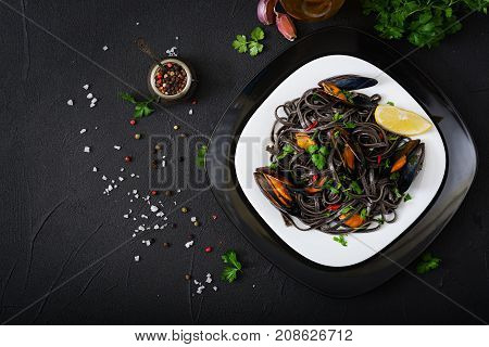 Black Spaghetti. Black Seafood Pasta With Mussels Over Black Background. Mediterranean Delicacy Food