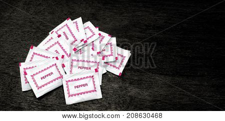 A Bunch of Convenient White Paper Pepper Packets