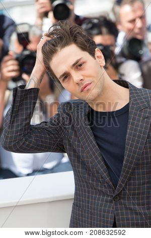 CANNES, FRANCE - MAY 19, 2016: Xavier Dolan attends the 'It's Only The End Of The World (Juste La Fin Du Monde)'  photocall during the 69th annual Cannes Film Festival at the Palais des Festivals 
