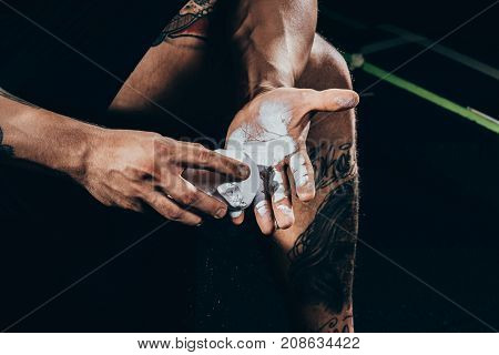 Sportsman Applying Talcum To Hands