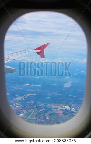 Earth and plane wing view from plane window
