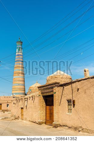 Islam Khodja Minaret at Itchan Kala. A UNESCO heritage site in Khiva, Uzbekistan