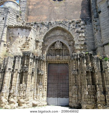 a ruined church door in seville spain