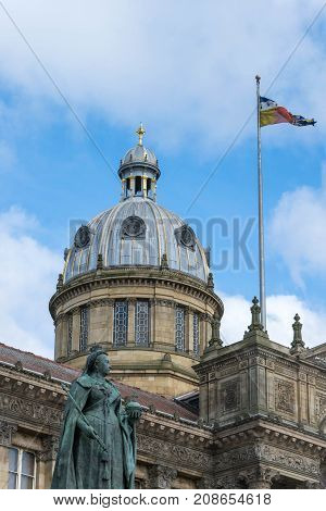 Birmingham, UK, October 3rd, 2017 : Statue of Queen Victoria in Birmingham, UK, Birmingham city council in the background.