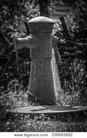 Old hand operated water pump on a side street