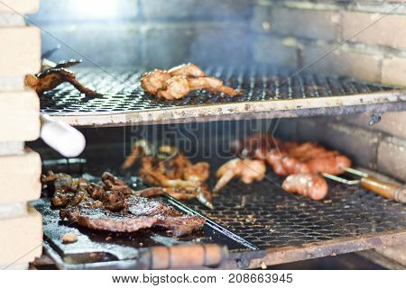 Brazilian Meat Grilling At A Churrasco