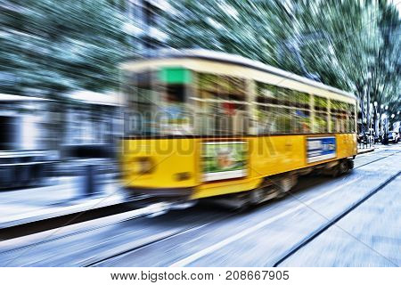 Blurred Movement Of A Old Vintage Orange Tram