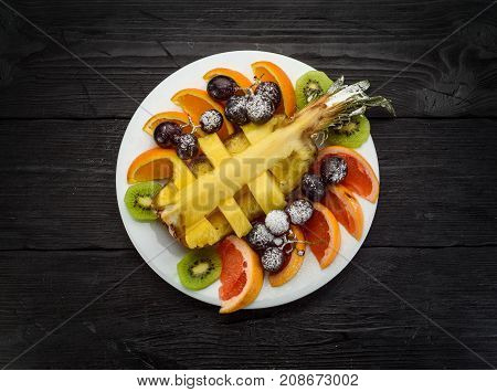 Fruit Plate On A Dark Wooden Background