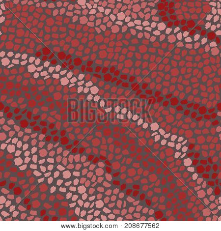 In the red range of warm colors seamless pattern of brush strokes-vector illustration. The smooth lines similar to stone