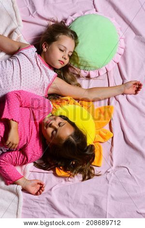 Schoolgirls In Pink Pajamas Sleep On Colorful Pillows, Top View